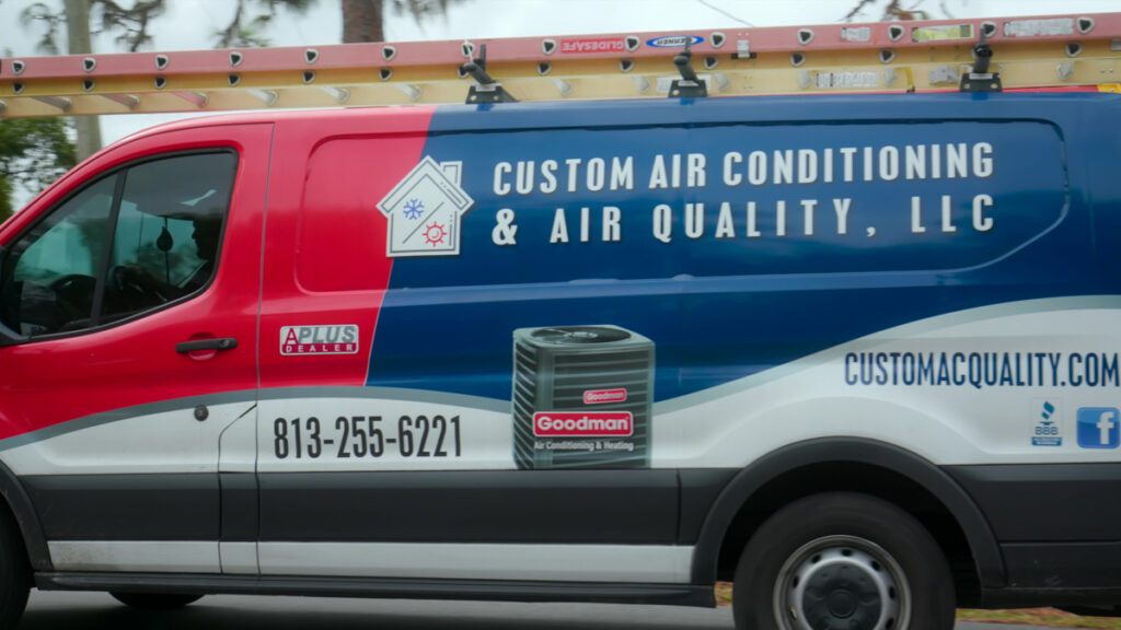 Close up of a custom air conditioning service truck during a job