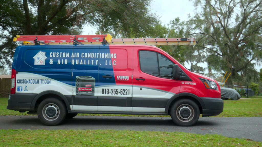 Custom air conditioning service truck during a job